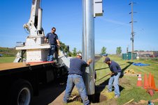 Setting pole with our 10-ton crane truck